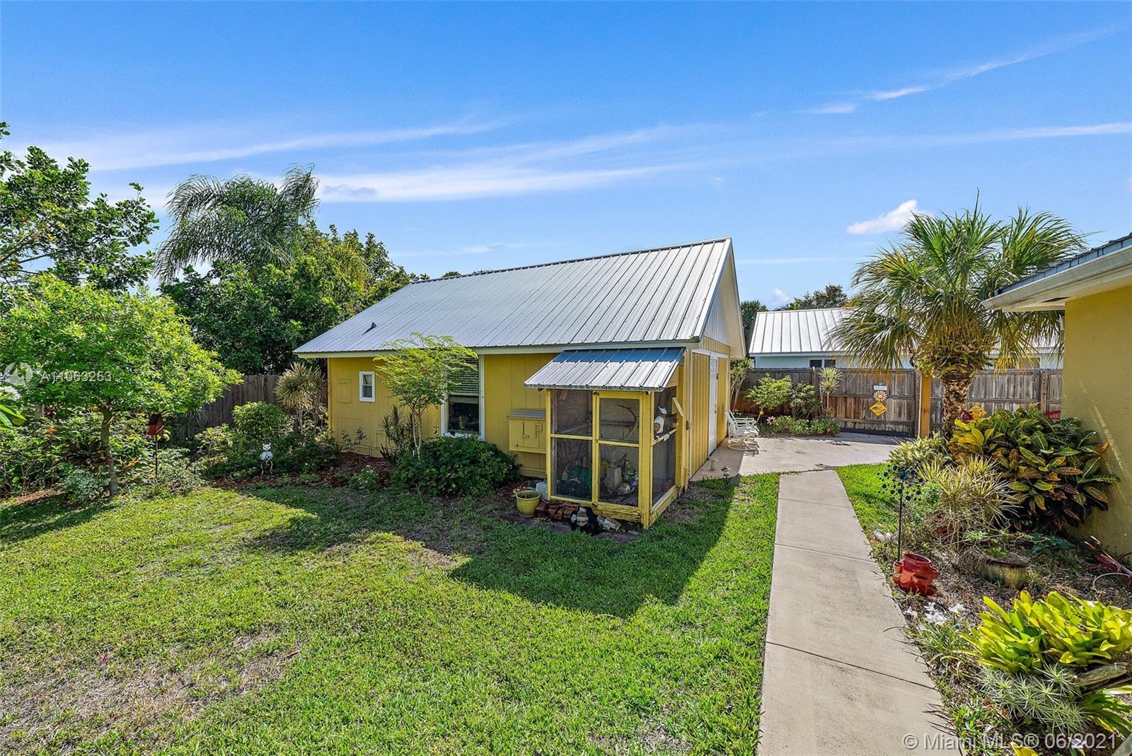 19 Shay Place Tequesta, FL 33469 - Photo 38 of 54 a view of a house with a garden