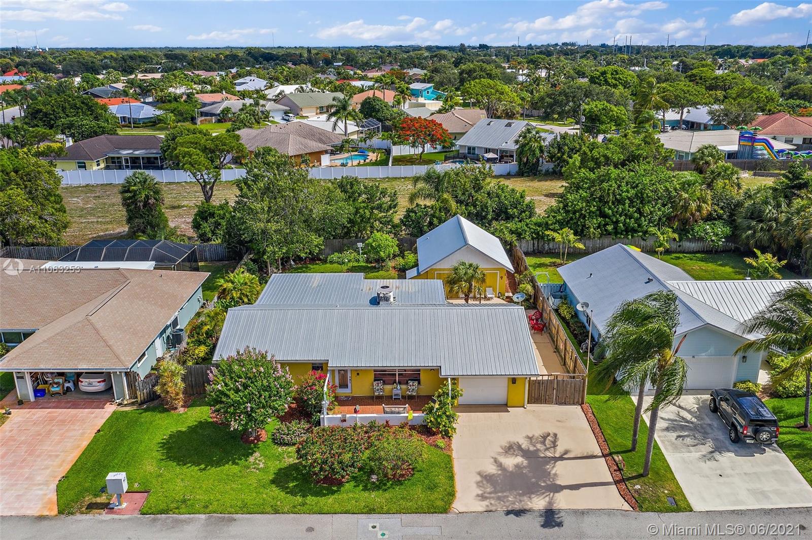 19 Shay Place Tequesta, FL 33469 - Photo 40 of 54 an aerial view of a house with a garden