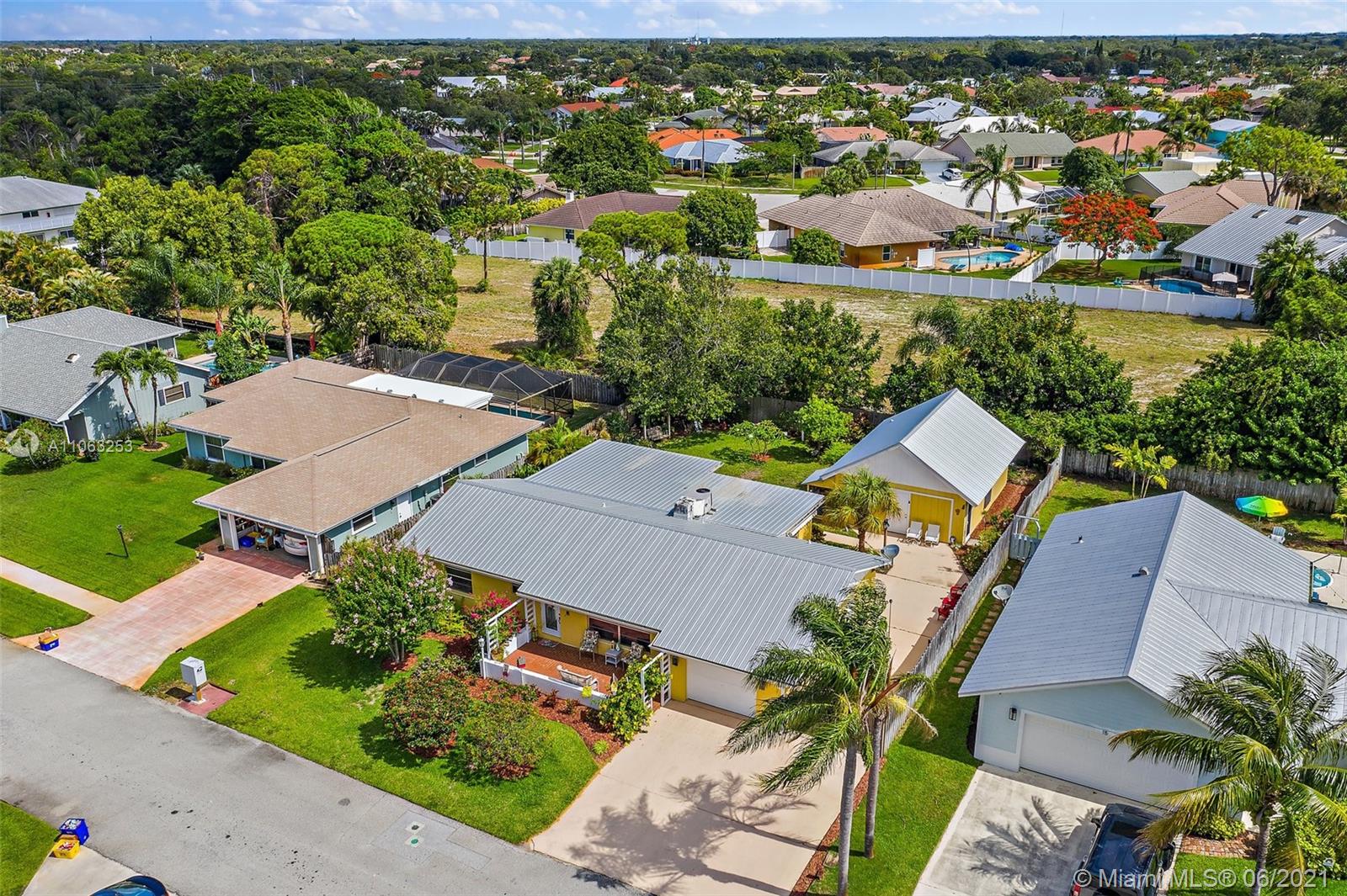 19 Shay Place Tequesta, FL 33469 - Photo 41 of 54 an aerial view of a house with a yard