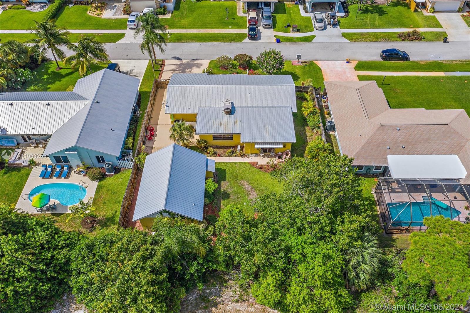 19 Shay Place Tequesta, FL 33469 - Photo 42 of 54 an aerial view of a house with a garden