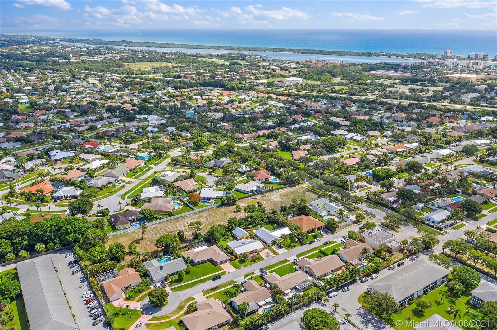 19 Shay Place Tequesta, FL 33469 - Photo 48 of 54 an aerial view of residential houses with outdoor space and trees