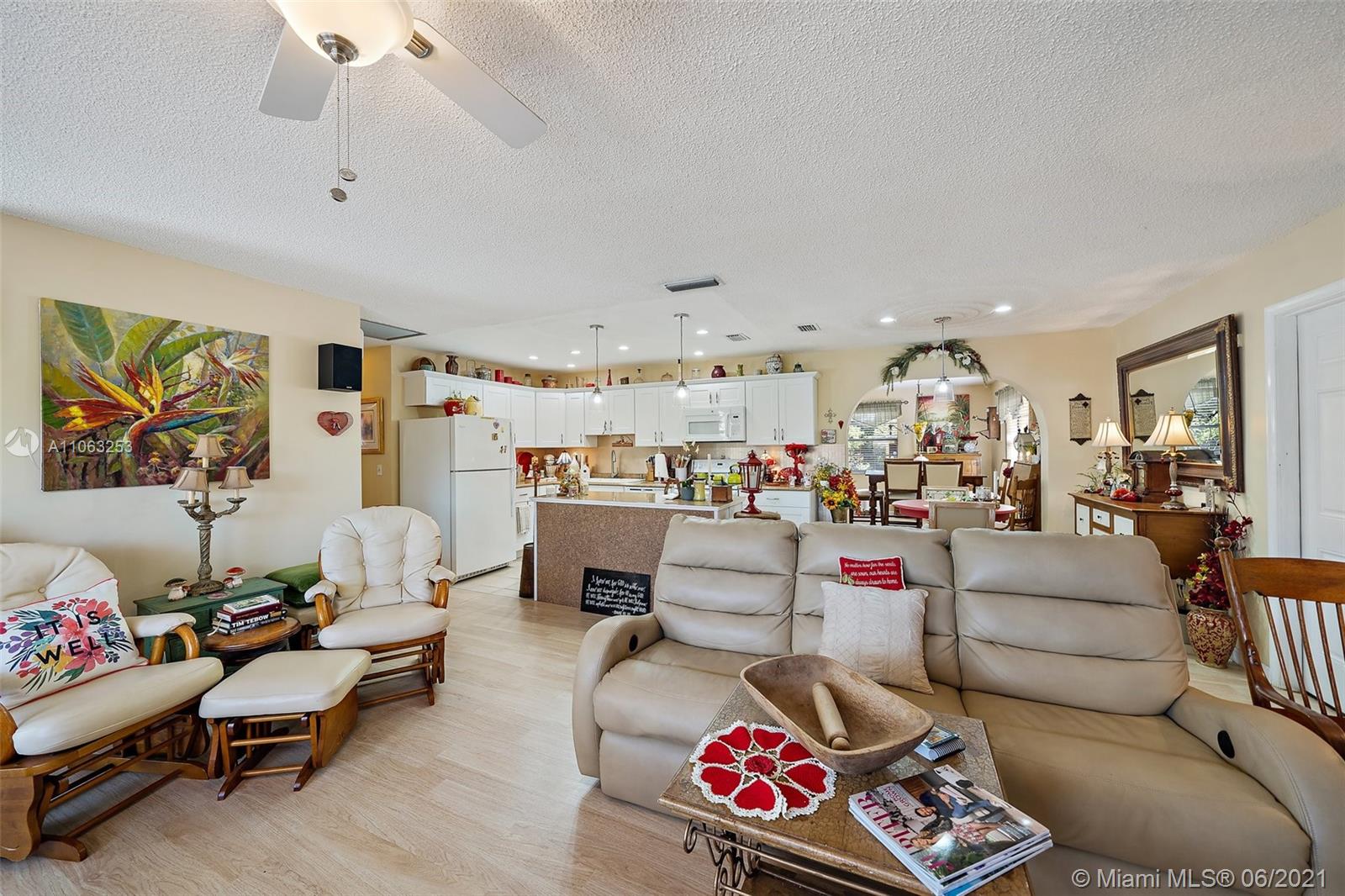 19 Shay Place Tequesta, FL 33469 - Photo 10 of 54 a living room with furniture and a book shelf