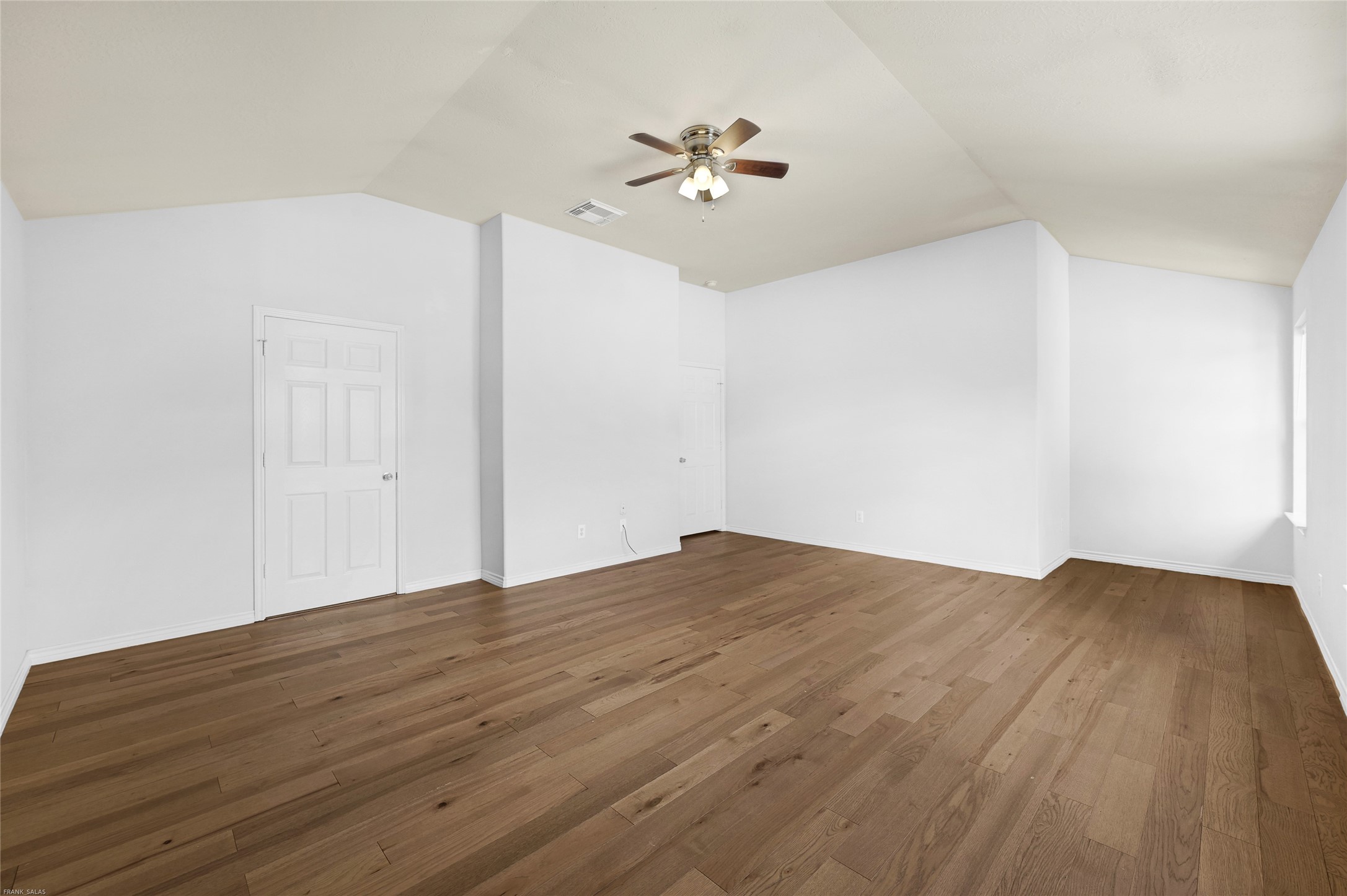 10407 Hamlet Vale Court Houston, TX 77070 - Photo 14 of 24 a view of a big room with wooden floor and closet in a room