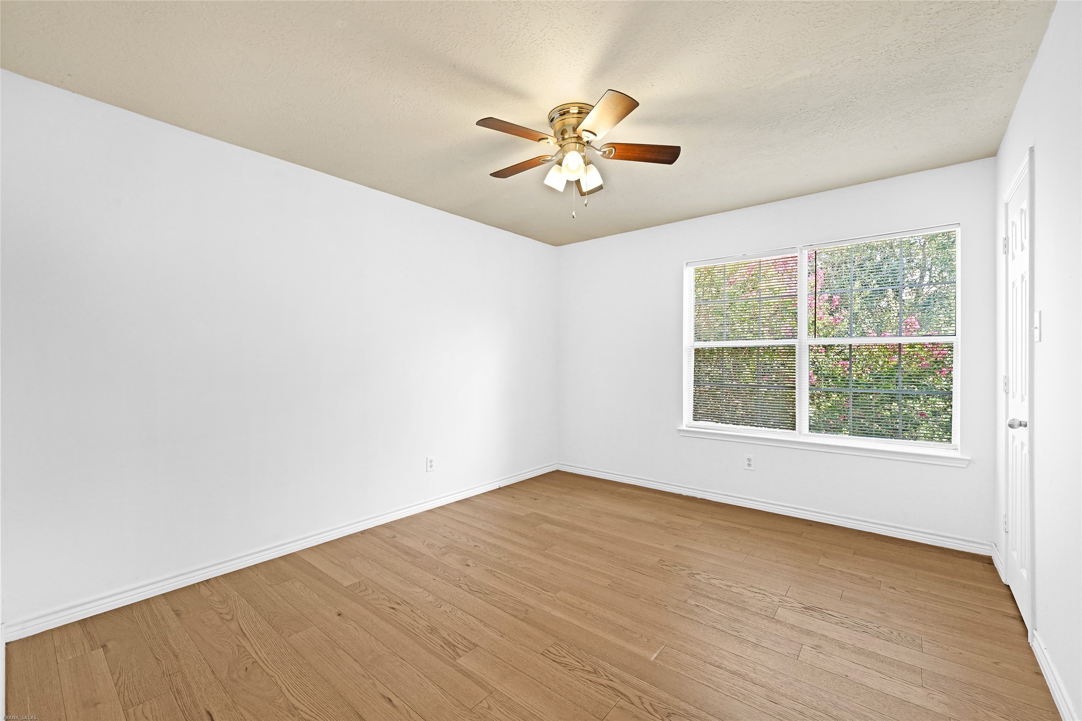 10407 Hamlet Vale Court Houston, TX 77070 - Photo 20 of 24 an empty room with a window and a fan