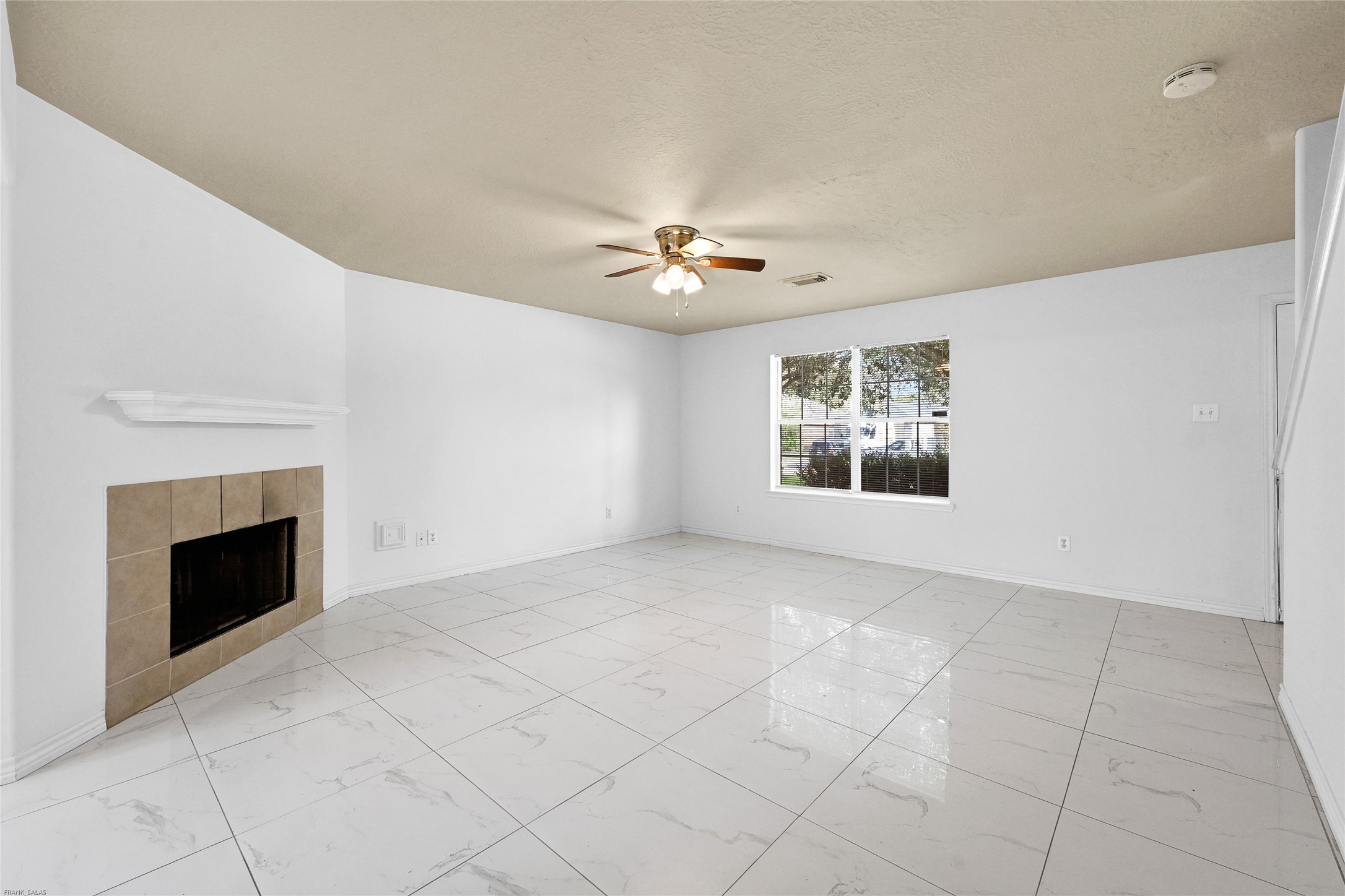 10407 Hamlet Vale Court Houston, TX 77070 - Photo 4 of 24 a view of an empty room with a fireplace