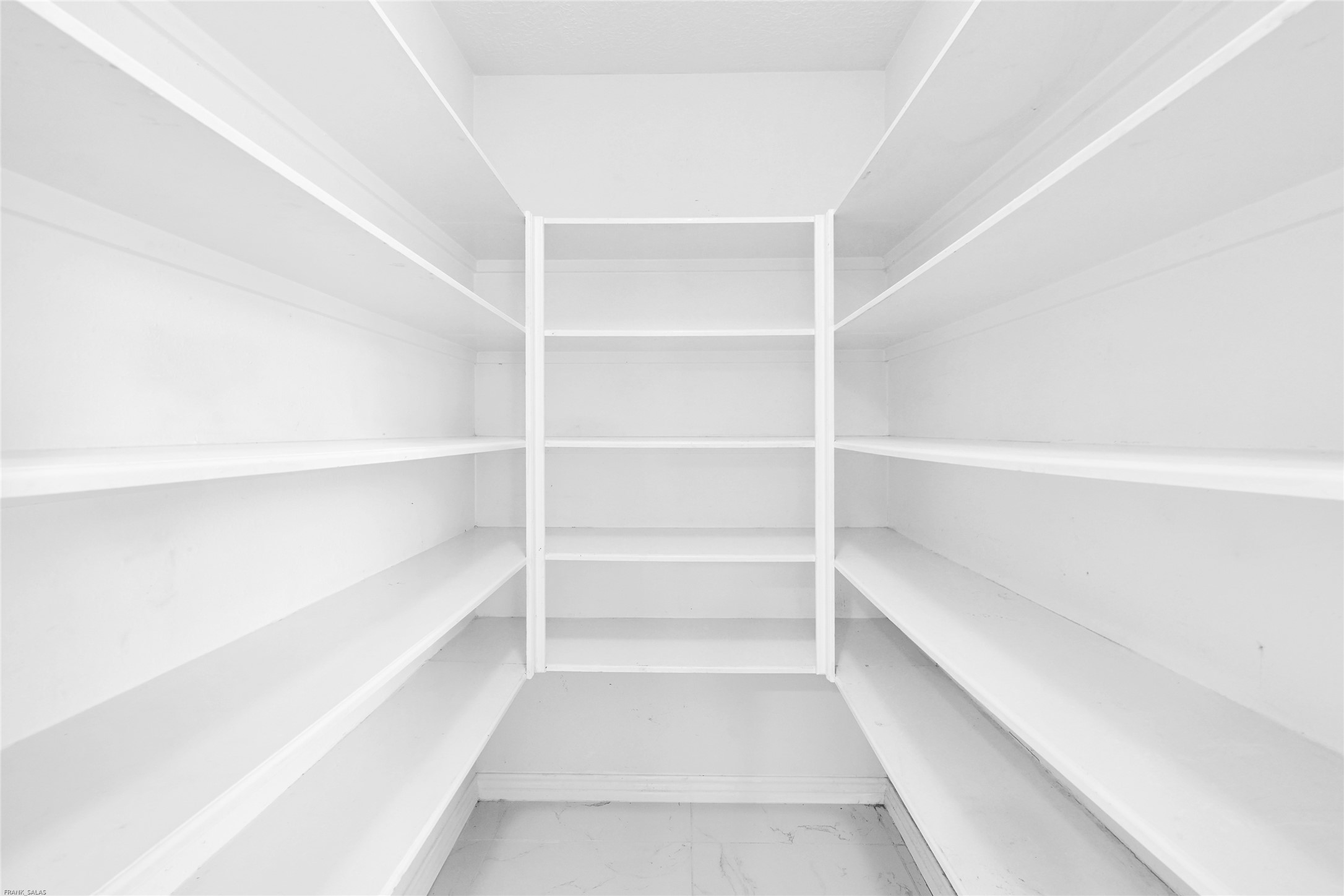 10407 Hamlet Vale Court Houston, TX 77070 - Photo 9 of 24 a view of a room with shelf on the wall