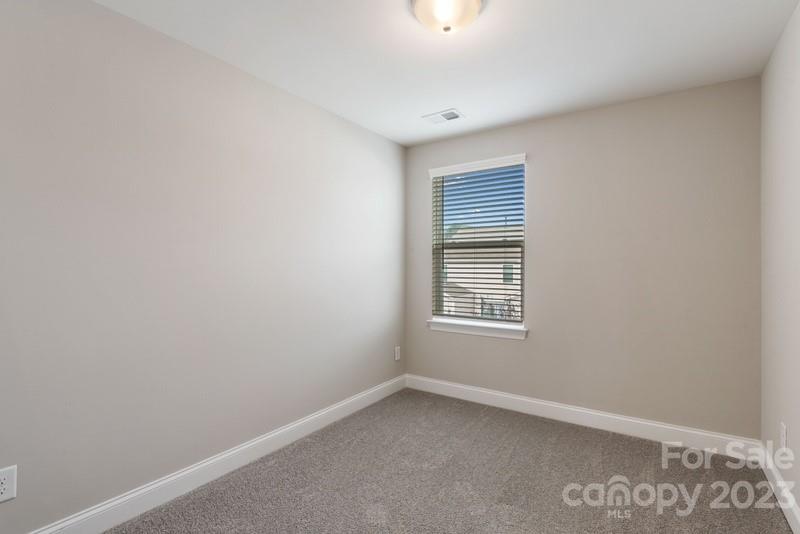 208 Waterlynn Ridge Road, Unit D Mooresville, NC 28117 - Photo 15 of 23 an empty room with a window