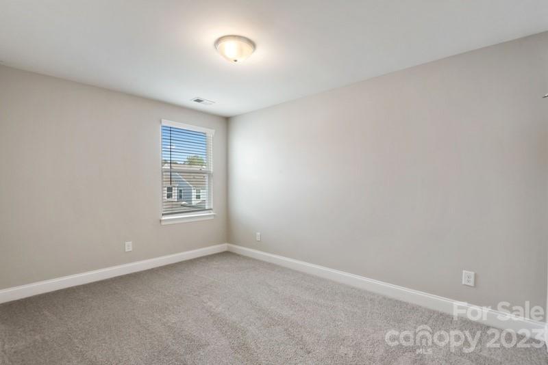 208 Waterlynn Ridge Road, Unit D Mooresville, NC 28117 - Photo 16 of 23 a view of room and window