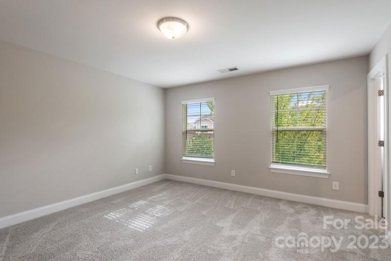 208 Waterlynn Ridge Road, Unit D Mooresville, NC 28117 - Photo 18 of 23 an empty room with windows