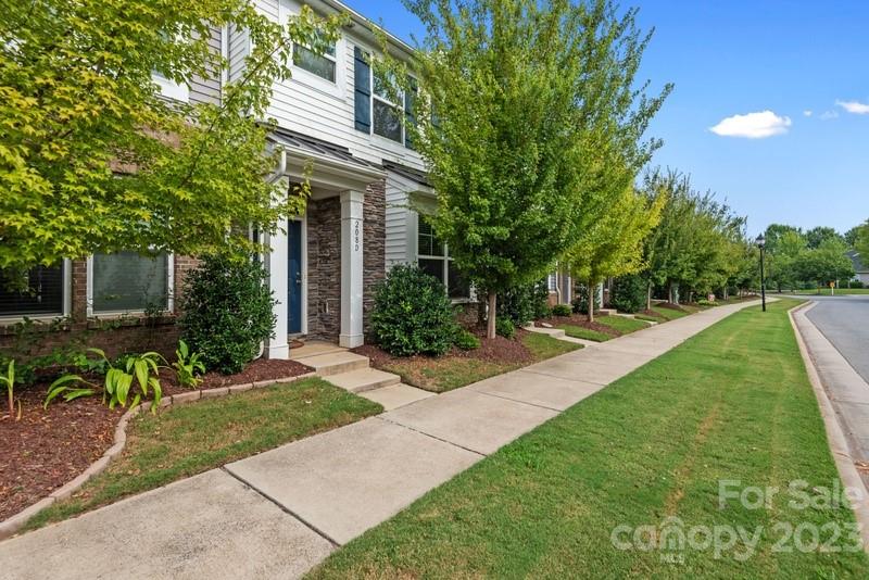 208 Waterlynn Ridge Road, Unit D Mooresville, NC 28117 - Photo 2 of 23 a view of a house with backyard and sitting area