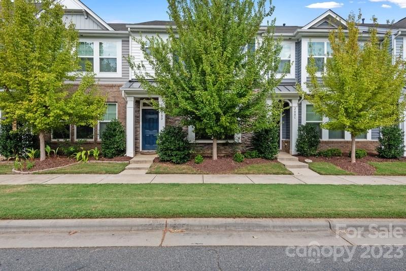 208 Waterlynn Ridge Road, Unit D Mooresville, NC 28117 - Photo 3 of 23 a front view of a house with a yard