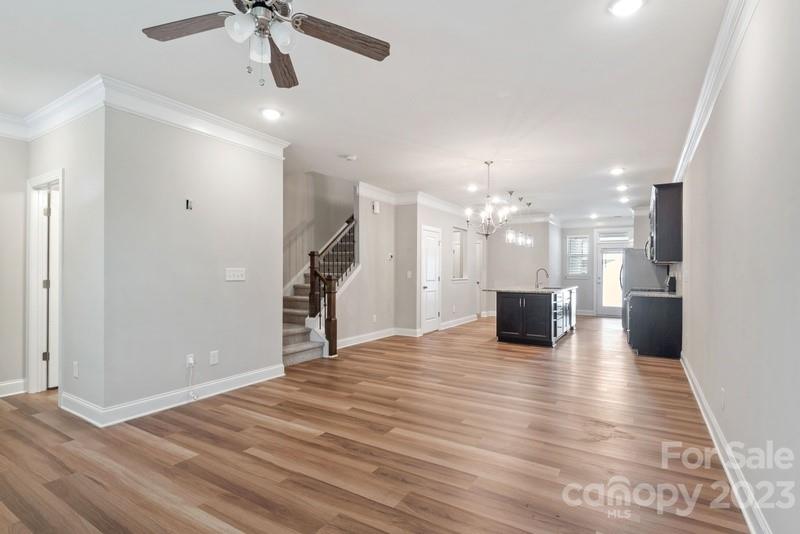 208 Waterlynn Ridge Road, Unit D Mooresville, NC 28117 - Photo 7 of 23 a view of a big room with wooden floor and a kitchen