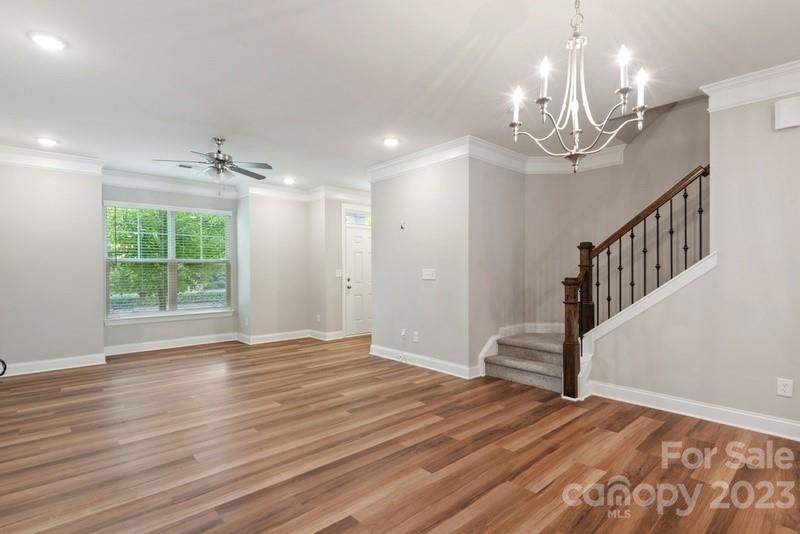 208 Waterlynn Ridge Road, Unit D Mooresville, NC 28117 - Photo 8 of 23 a view of a livingroom with wooden floor and a large window