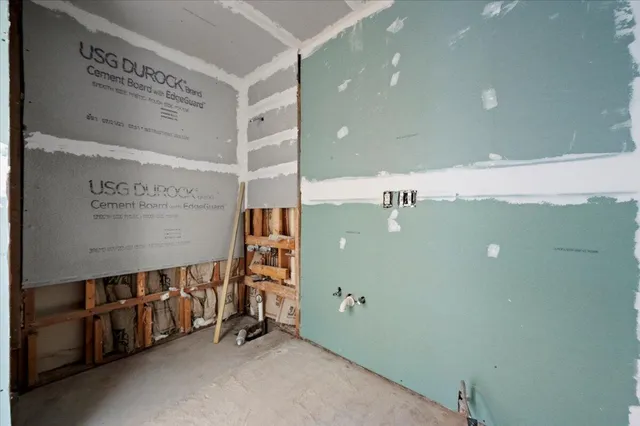 a view of a hallway with stairs