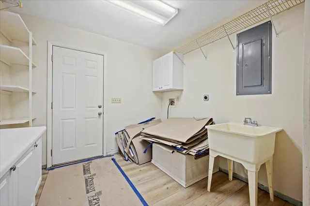 a room with a table chairs and wooden floor
