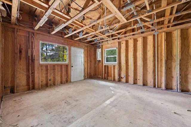 a view of an empty room with wooden frame