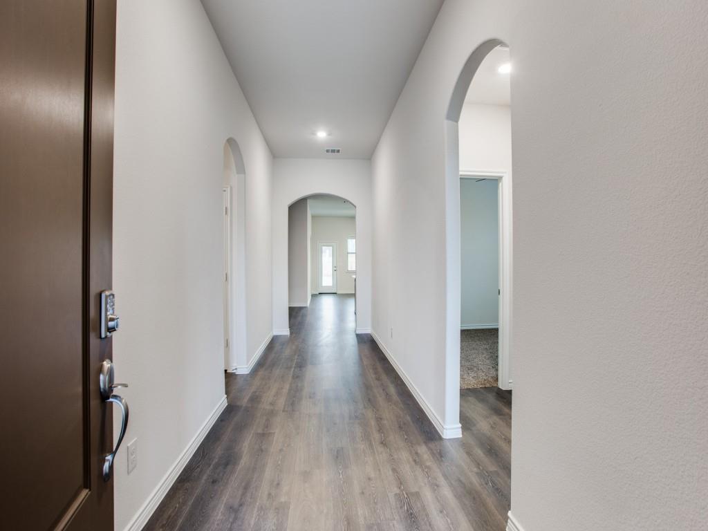 123 Lakeview Circle Pilot Point, TX 76258 - Photo 10 of 39 a view of a hallway with wooden floor