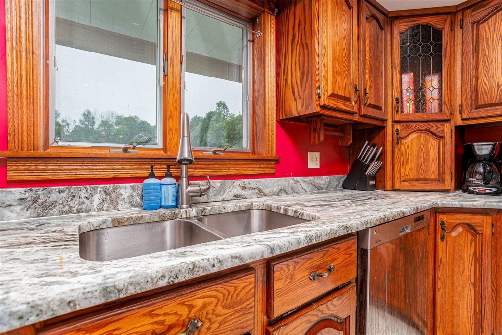 54 Charles Street Gardner, MA 01440 - Photo 5 of 40 a kitchen with granite countertop a sink and a window