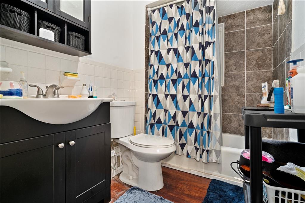 7709 Juniata Street Pittsburgh, PA 15218 - Photo 12 of 22 a bathroom with a sink toilet and shower