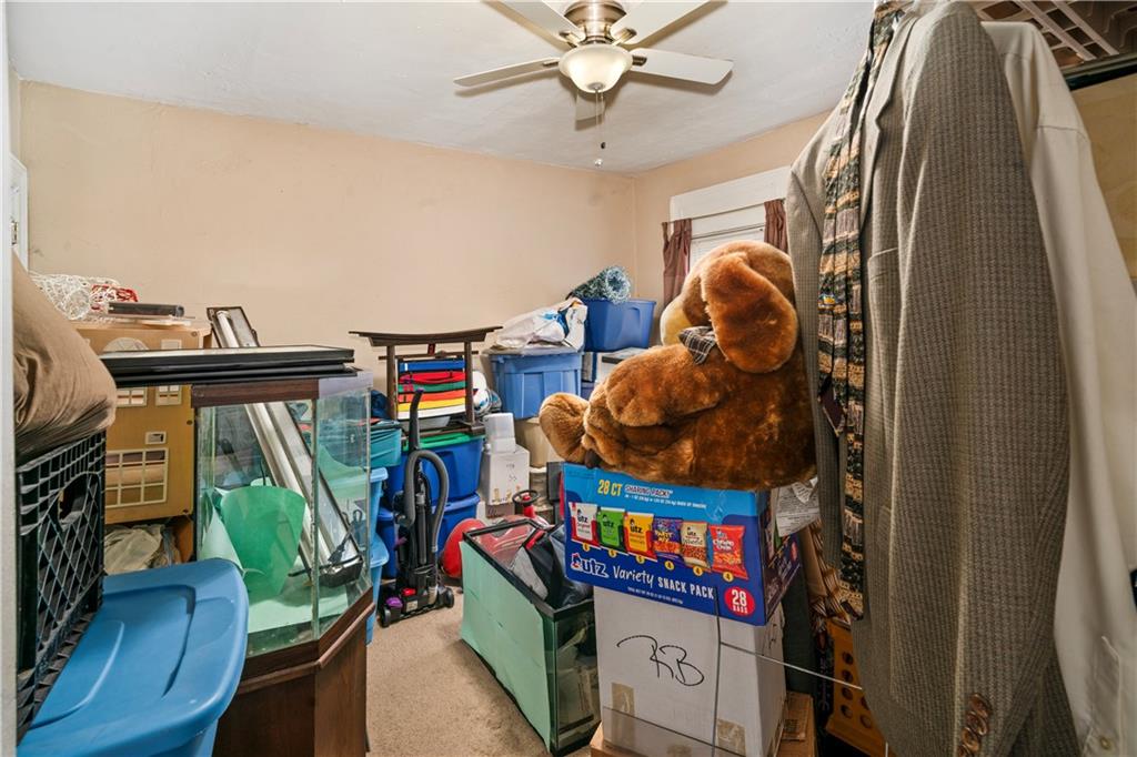 7709 Juniata Street Pittsburgh, PA 15218 - Photo 13 of 22 a living room with furniture and a wooden floor