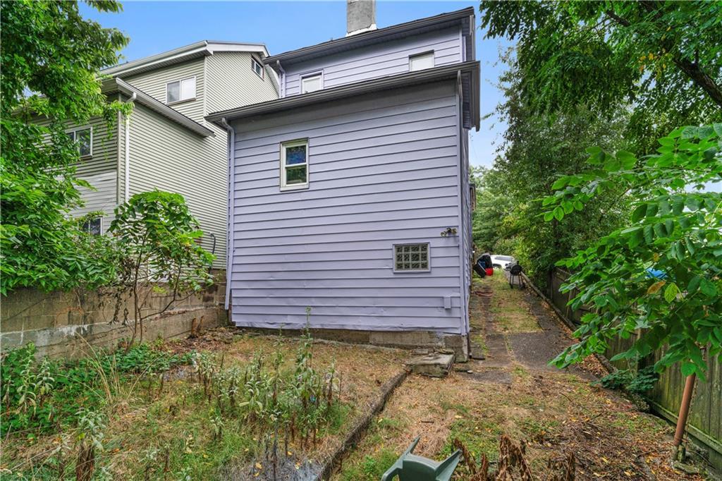 7709 Juniata Street Pittsburgh, PA 15218 - Photo 22 of 22 a view of a house with a yard