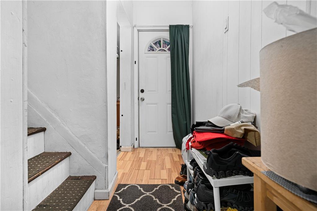 7709 Juniata Street Pittsburgh, PA 15218 - Photo 5 of 22 a bedroom with a bed and a walk in closet