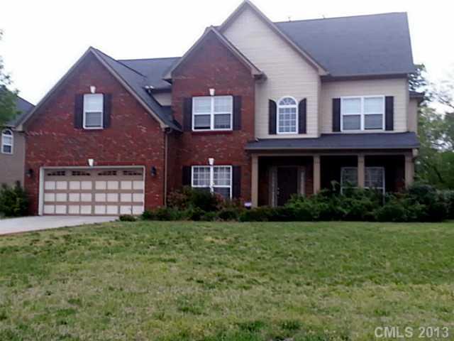 4001 Sedgewick Road Indian Trail, NC 28079 - Photo 1 of 4 a view of a brick house with a yard