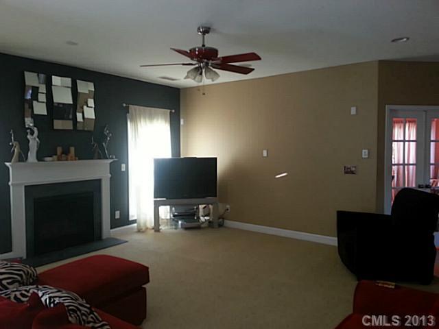 4001 Sedgewick Road Indian Trail, NC 28079 - Photo 2 of 4 a living room with furniture and a fireplace