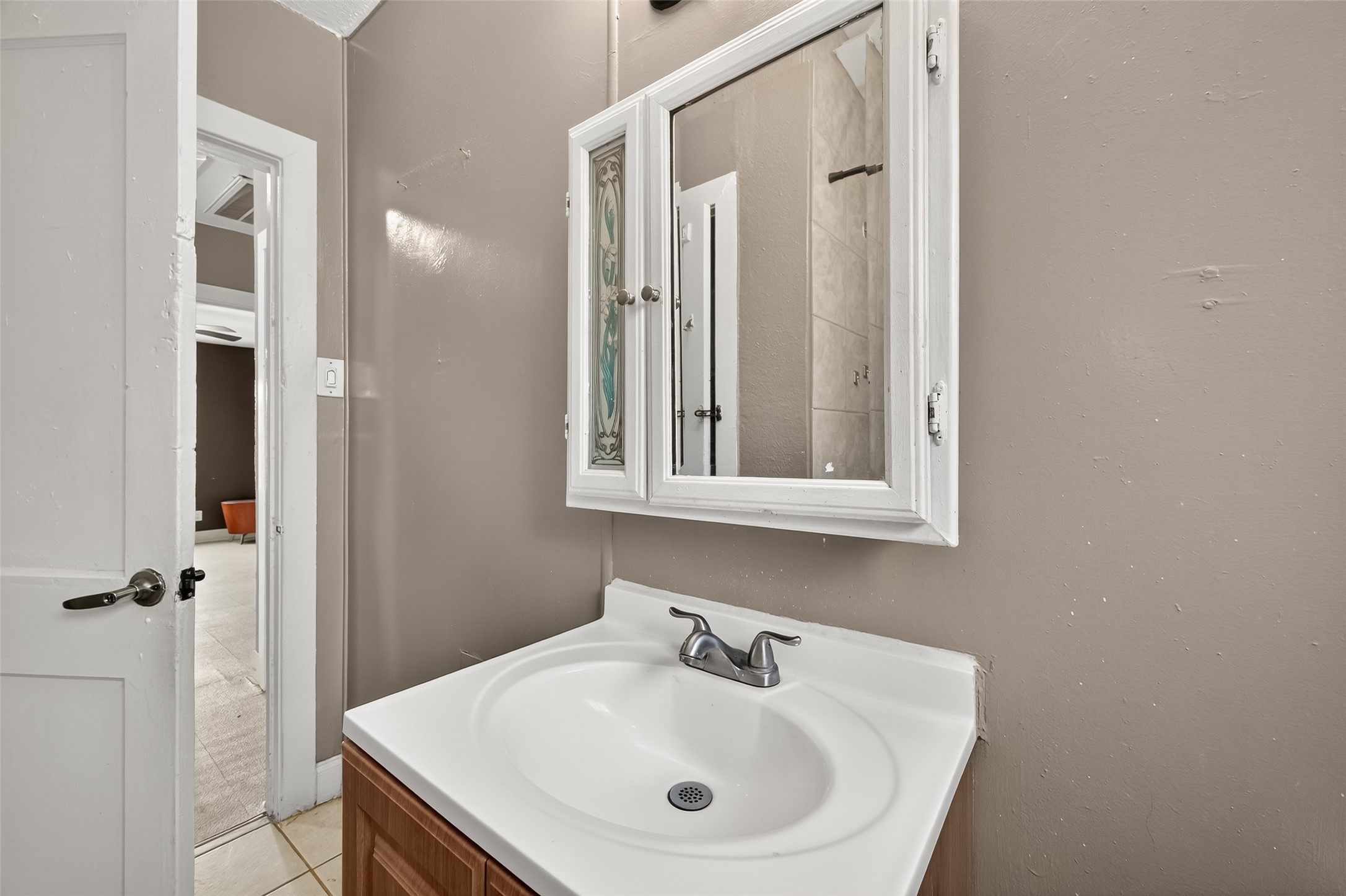 7111 Myrtle Street Houston, TX 77087 - Photo 19 of 24 a bathroom with a sink and a mirror