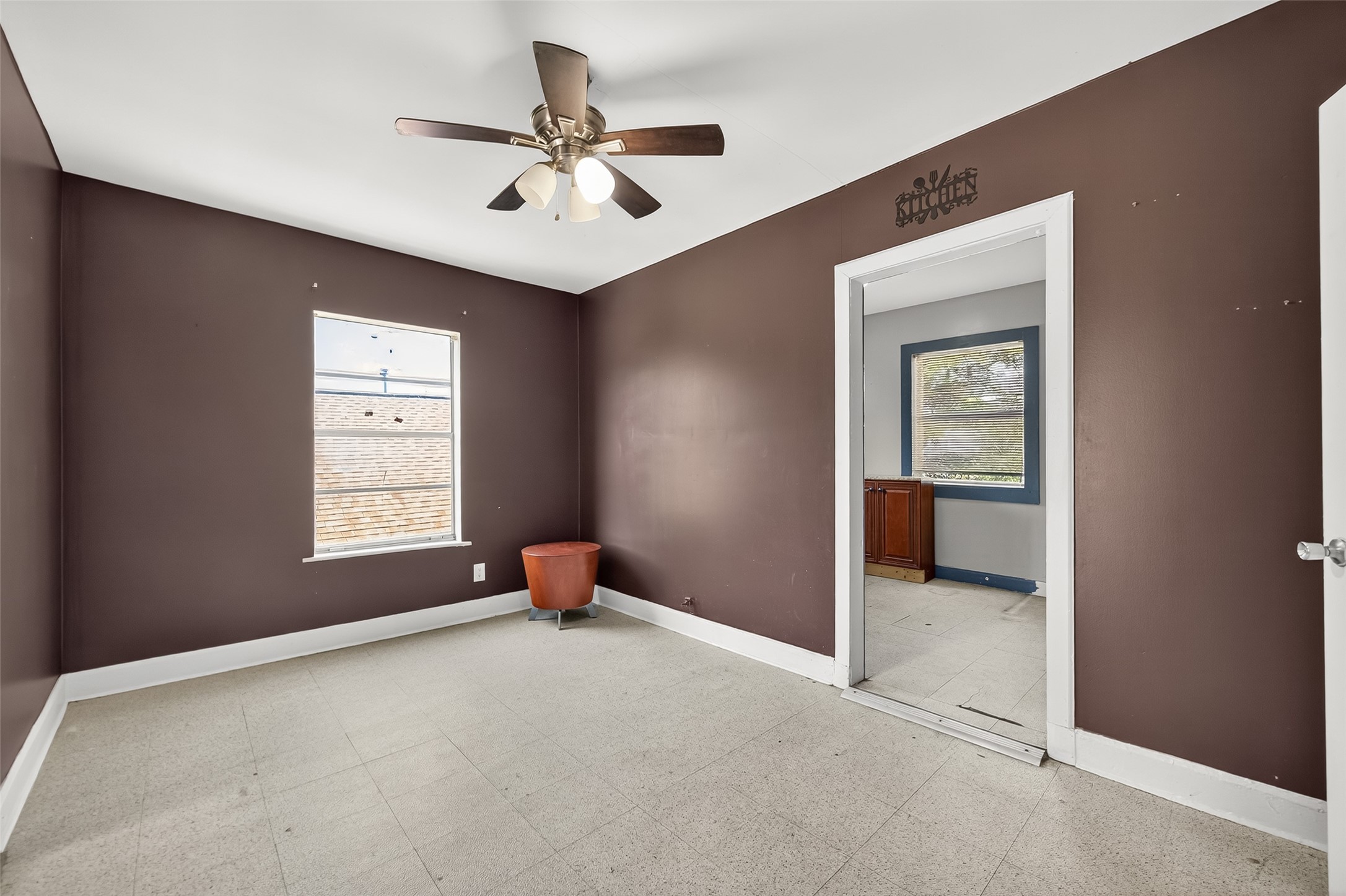 7111 Myrtle Street Houston, TX 77087 - Photo 7 of 24 a view of a livingroom with a ceiling fan and window
