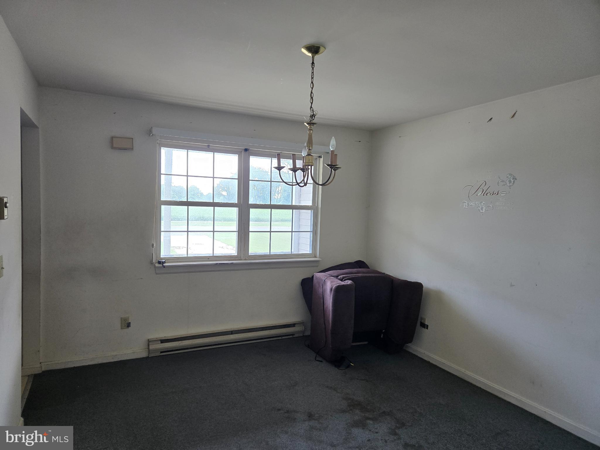 8806 Greentop Road Lincoln, DE 19960 - Photo 11 of 35 a room with window and a ceiling fan