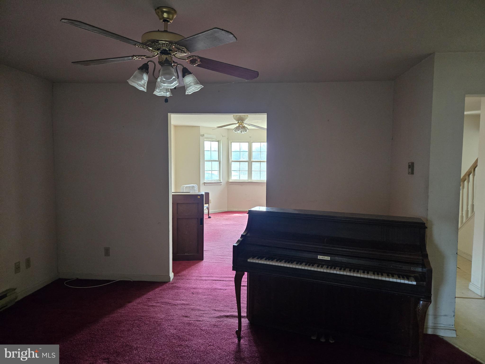 8806 Greentop Road Lincoln, DE 19960 - Photo 17 of 35 a room with chandelier fan and windows