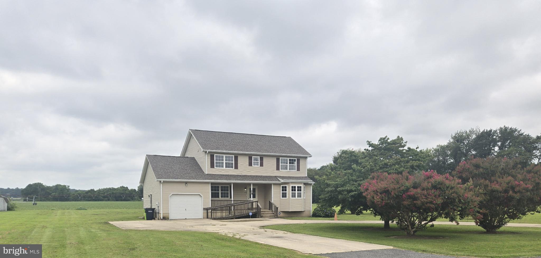 8806 Greentop Road Lincoln, DE 19960 - Photo 2 of 35 a front view of a house with garden