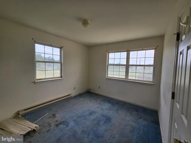 an empty room with windows