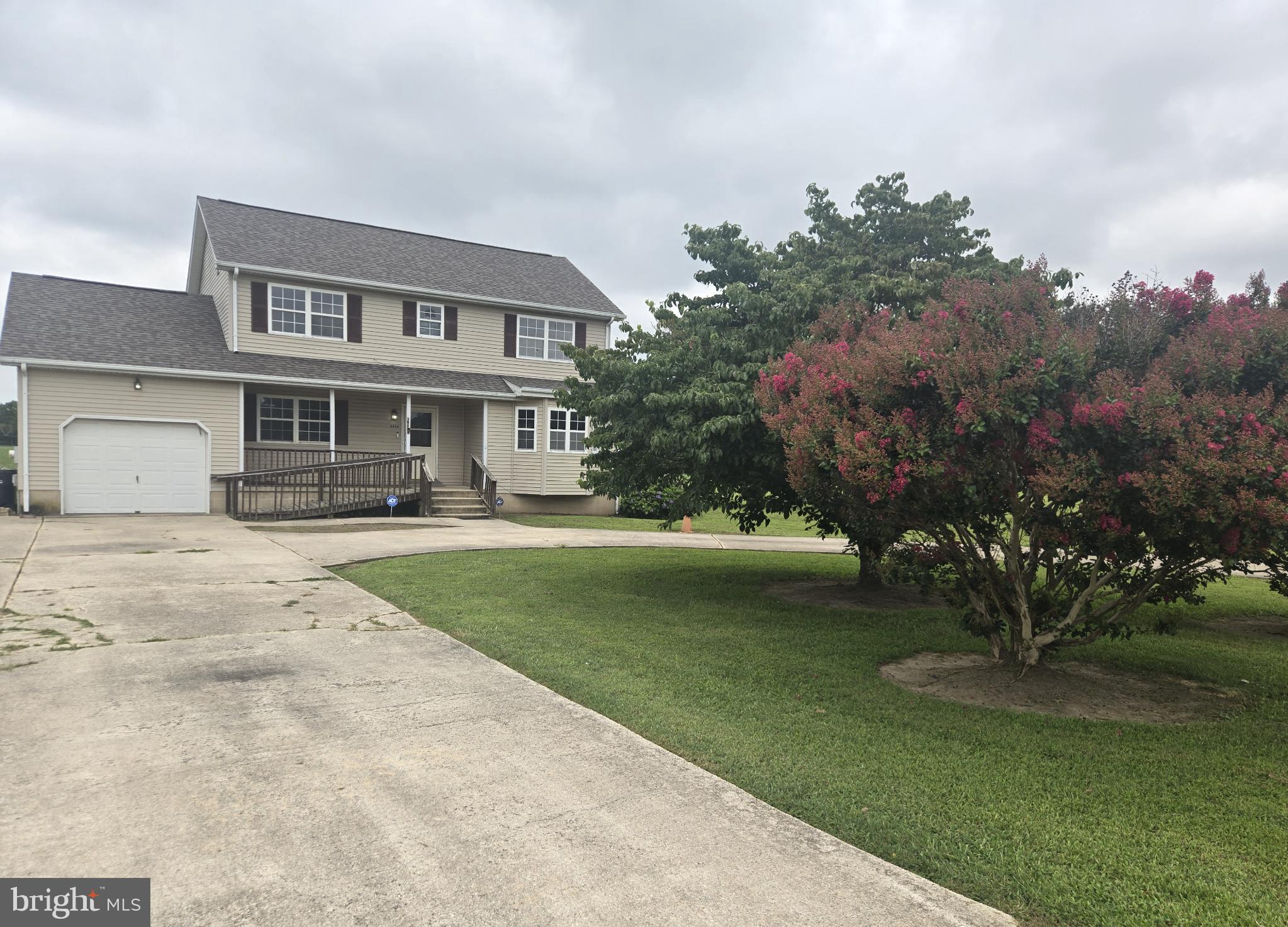 8806 Greentop Road Lincoln, DE 19960 - Photo 3 of 35 a front view of a house with a garden