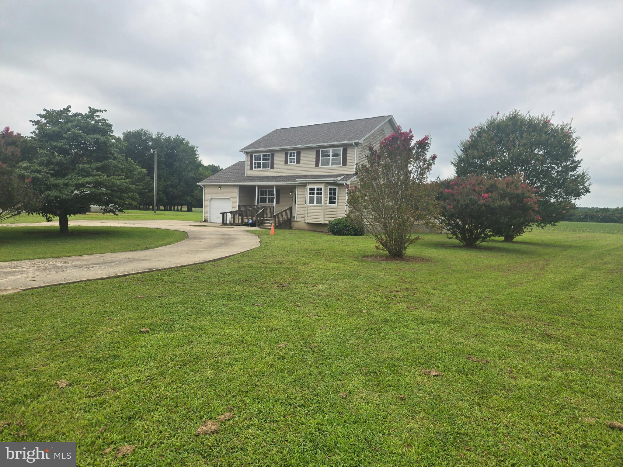 8806 Greentop Road Lincoln, DE 19960 - Photo 4 of 35 a view of a house with a big yard and large trees