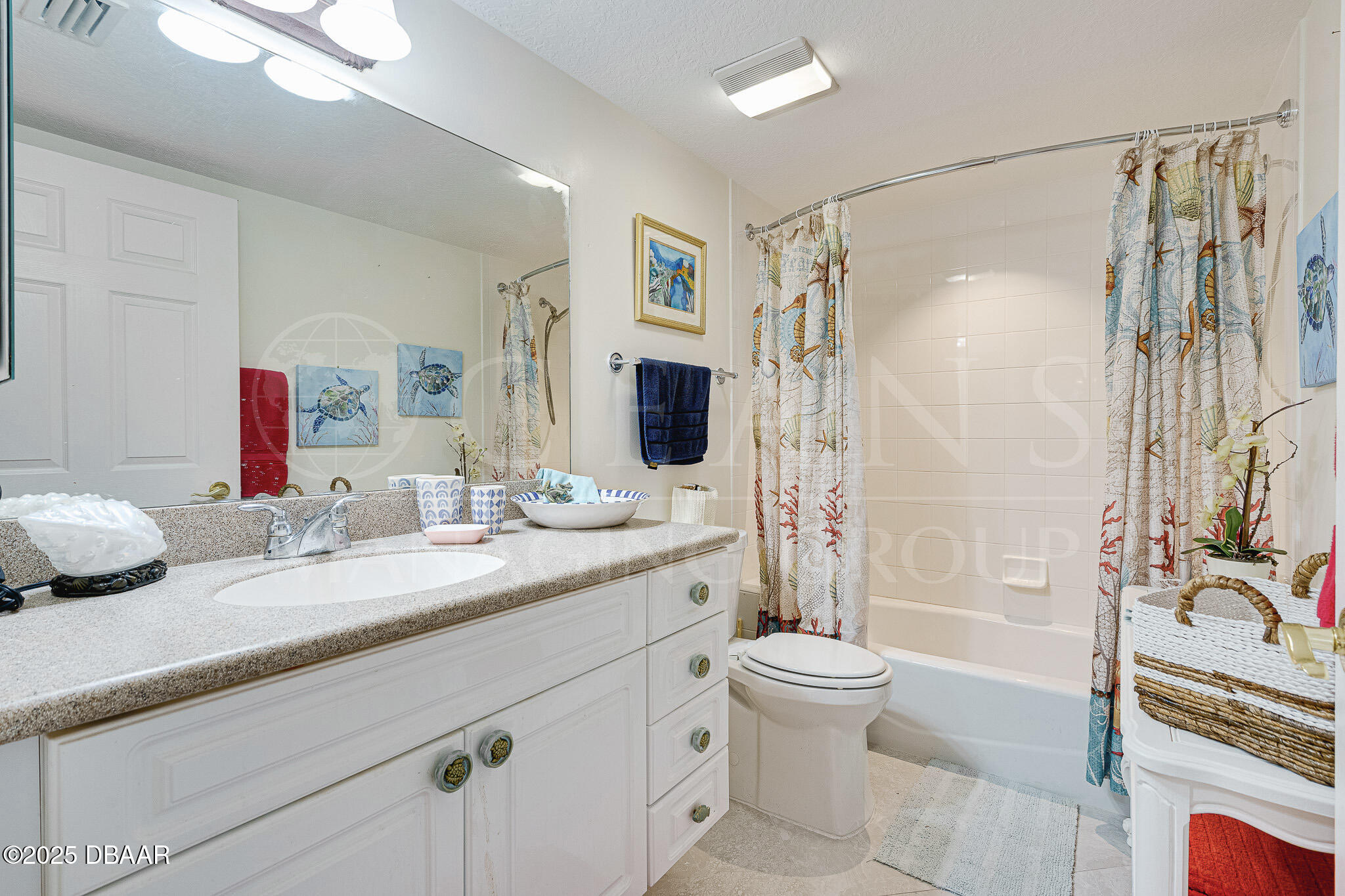 4650 Links Village Drive, Unit C303 Ponce Inlet, FL 32127 - Photo 16 of 67 a bathroom with a granite countertop sink toilet mirror and shower