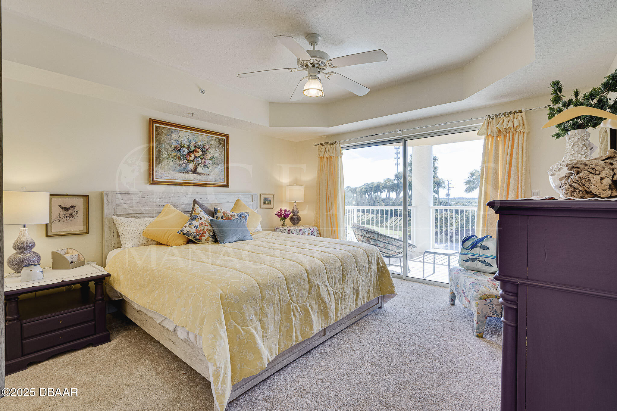 4650 Links Village Drive, Unit C303 Ponce Inlet, FL 32127 - Photo 18 of 67 a spacious bedroom with a bed and a large window