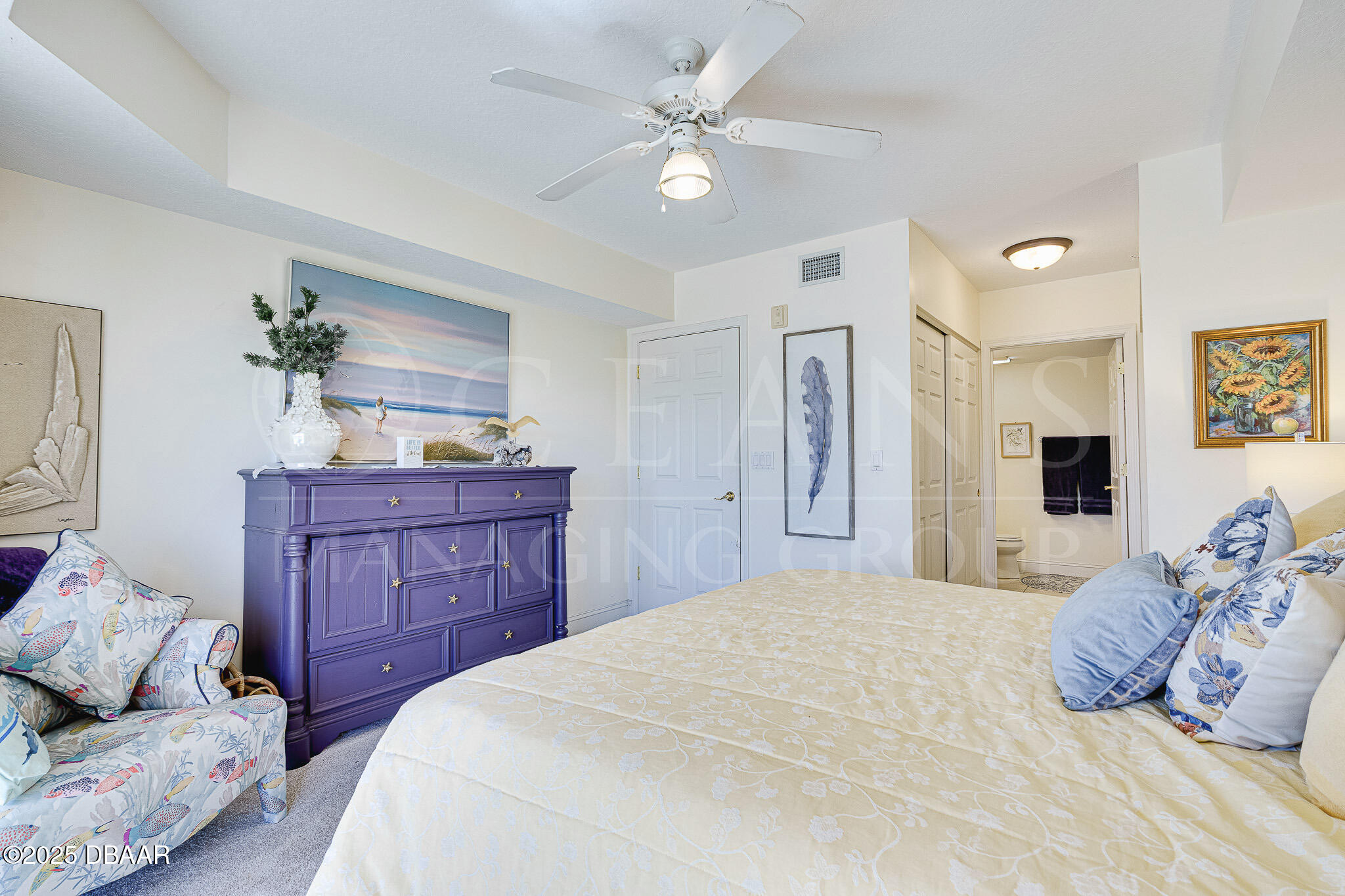 4650 Links Village Drive, Unit C303 Ponce Inlet, FL 32127 - Photo 19 of 67 a bedroom with a large bed and a dresser