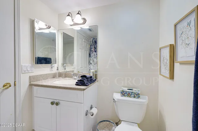 a bathroom with a double vanity sink mirror and