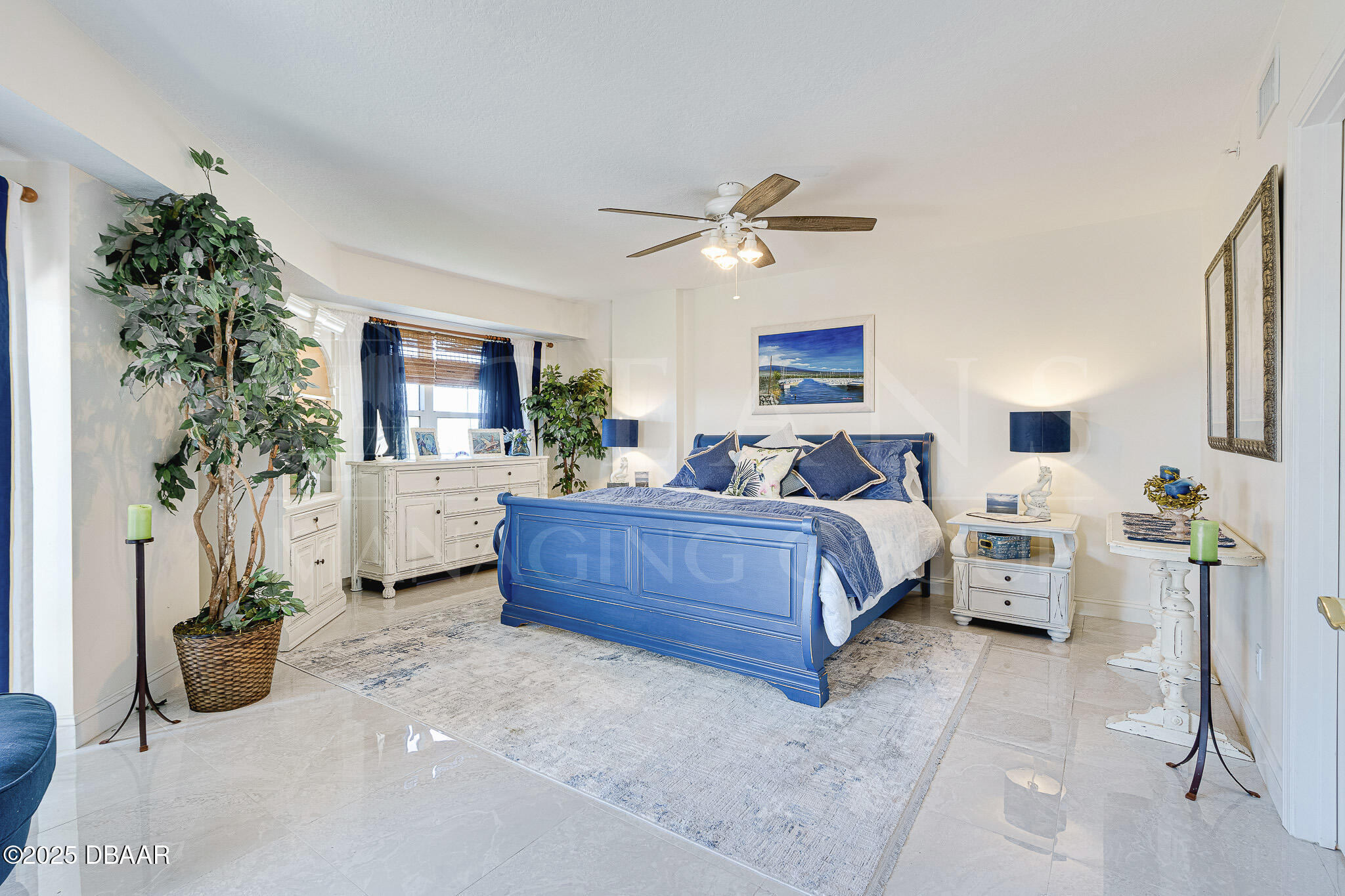 4650 Links Village Drive, Unit C303 Ponce Inlet, FL 32127 - Photo 23 of 67 a bedroom with a bed couch and a potted plant