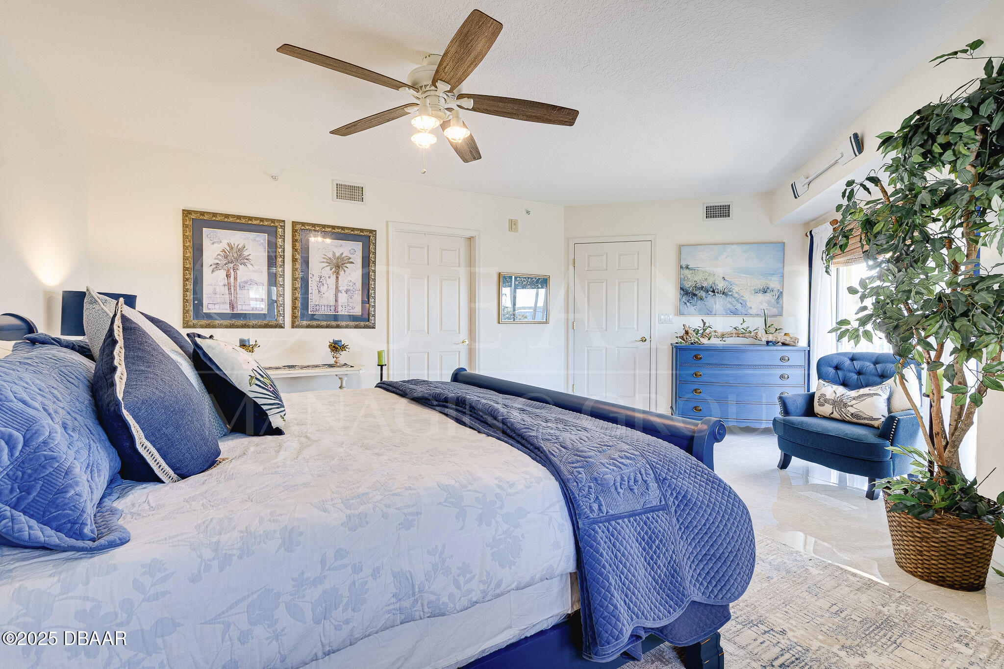 4650 Links Village Drive, Unit C303 Ponce Inlet, FL 32127 - Photo 25 of 67 a bed room with a bed and a couch