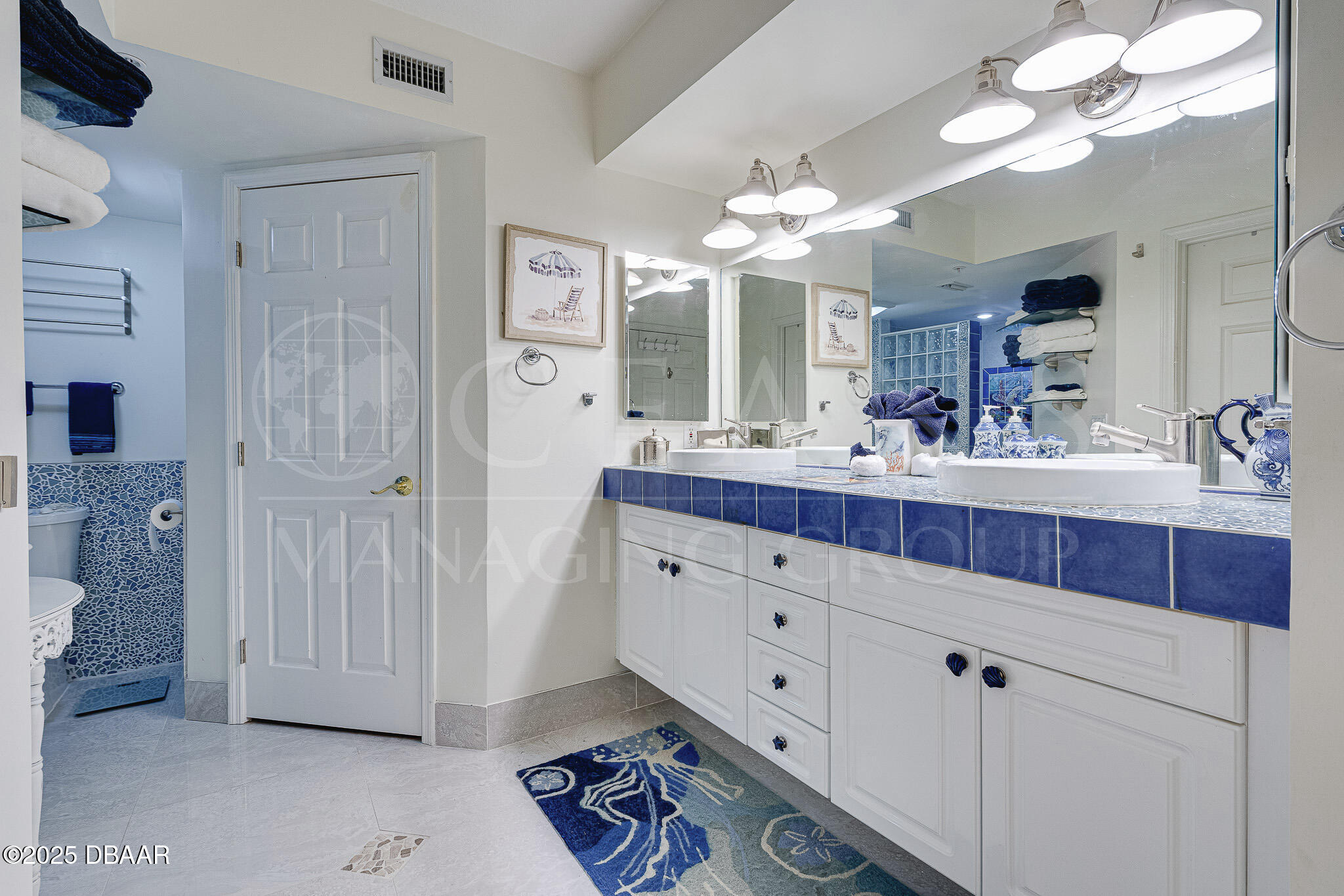 4650 Links Village Drive, Unit C303 Ponce Inlet, FL 32127 - Photo 27 of 67 a bathroom with a double vanity sink mirror and