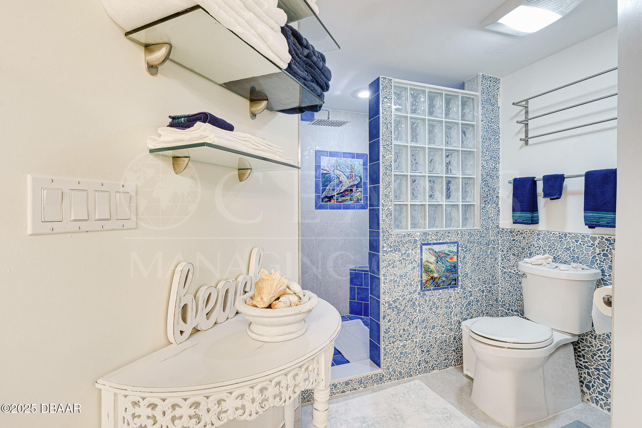 4650 Links Village Drive, Unit C303 Ponce Inlet, FL 32127 - Photo 28 of 67 a bathroom with a toilet and a sink