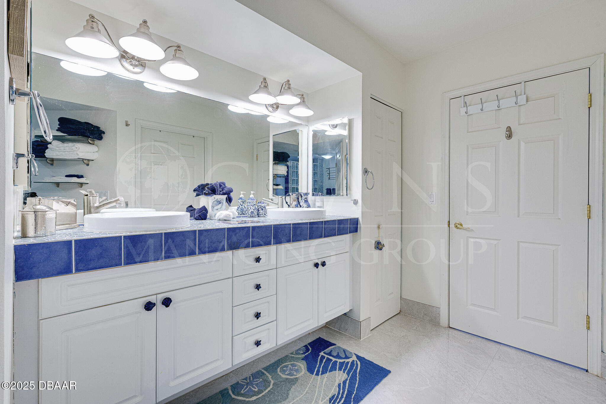 4650 Links Village Drive, Unit C303 Ponce Inlet, FL 32127 - Photo 29 of 67 a bathroom with a sink vanity and a mirror