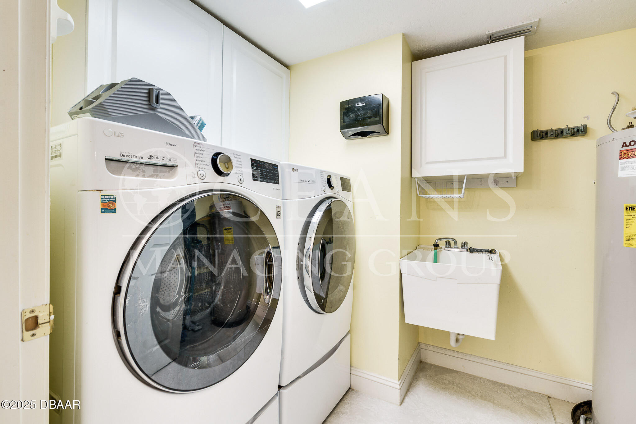 4650 Links Village Drive, Unit C303 Ponce Inlet, FL 32127 - Photo 31 of 67 a utility room with dryer and washer