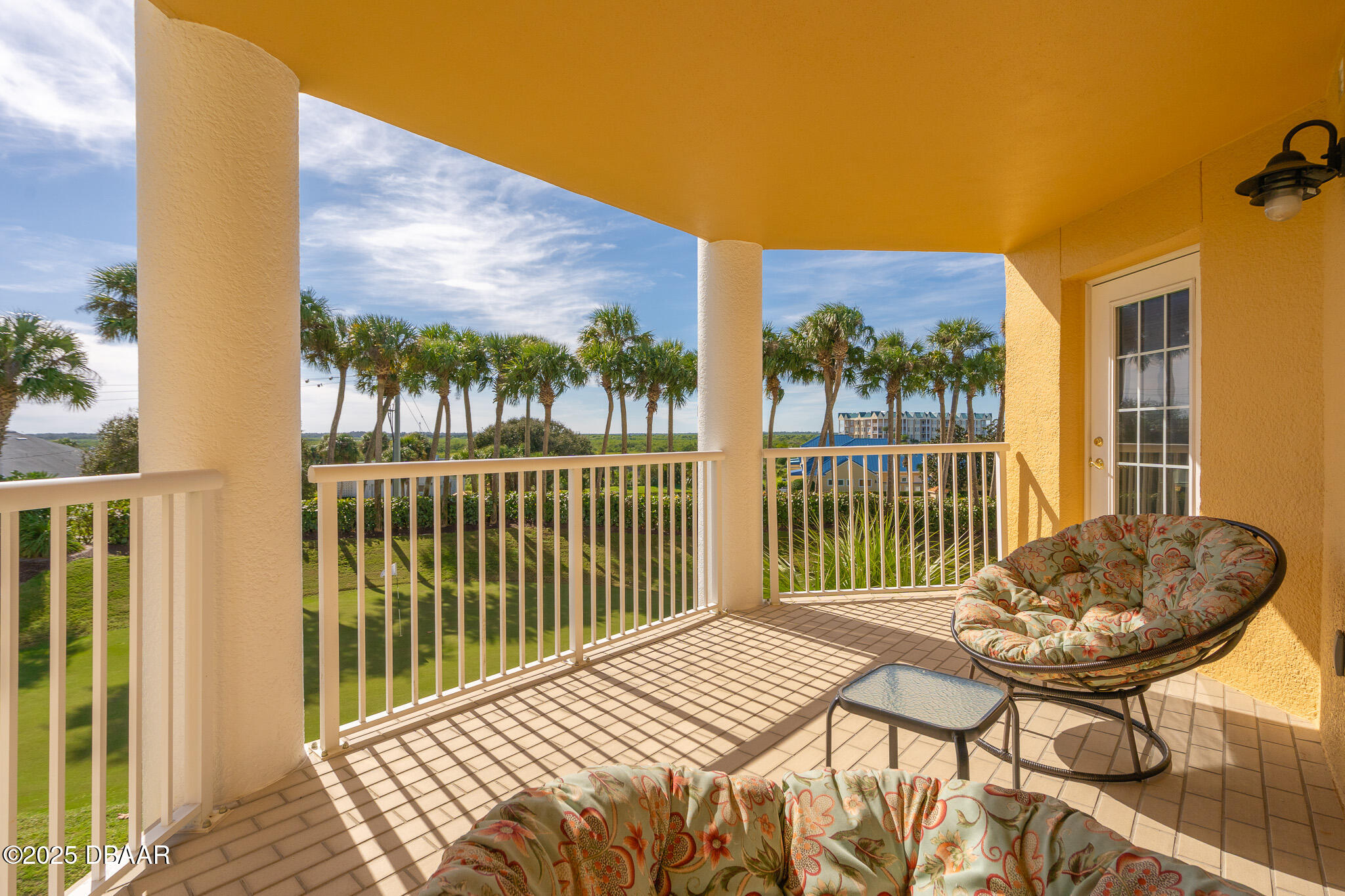 4650 Links Village Drive, Unit C303 Ponce Inlet, FL 32127 - Photo 33 of 67 a balcony view with a backyard space