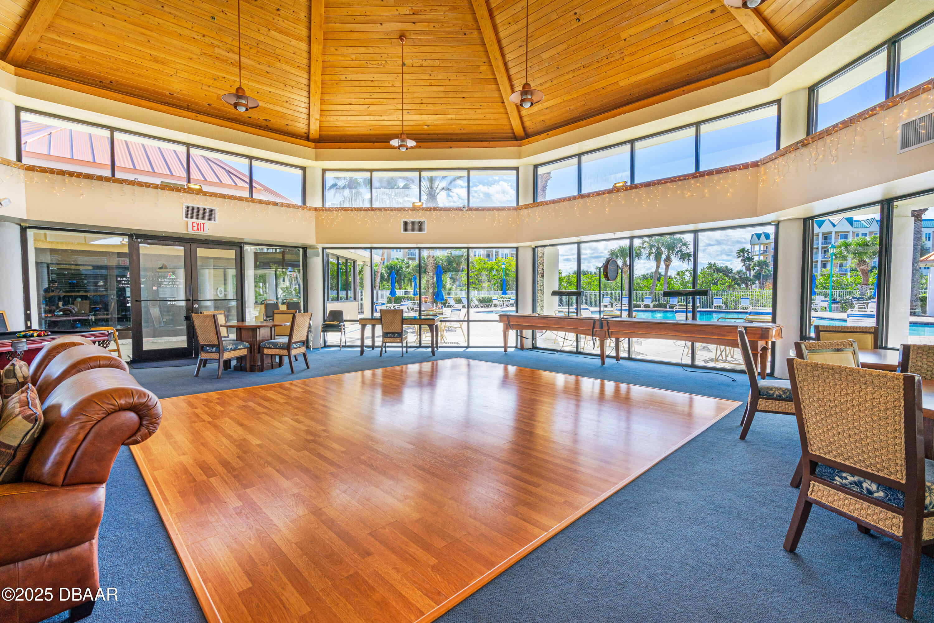 4650 Links Village Drive, Unit C303 Ponce Inlet, FL 32127 - Photo 50 of 67 a view of a swimming pool with outdoor seating