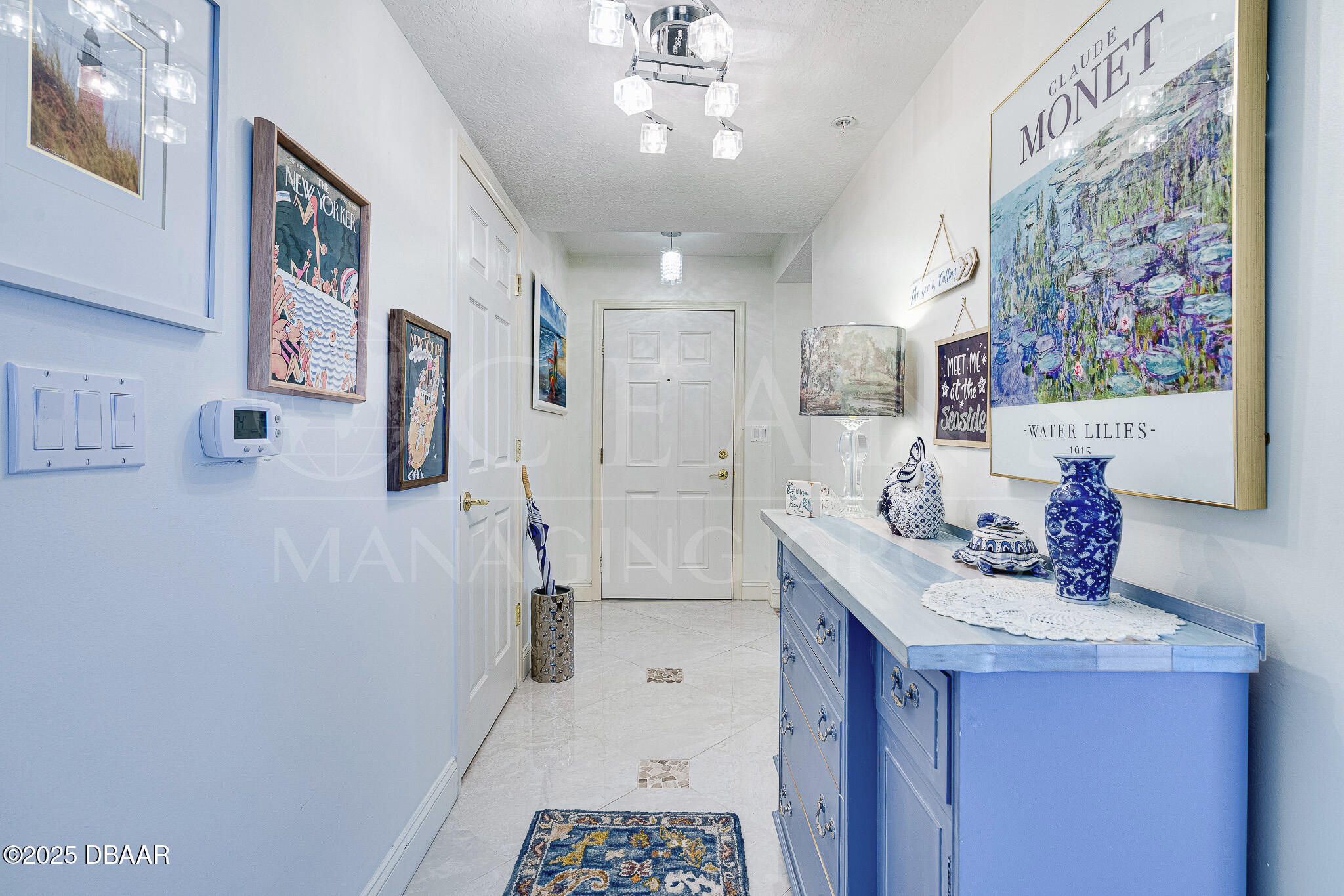 4650 Links Village Drive, Unit C303 Ponce Inlet, FL 32127 - Photo 5 of 67 a bathroom with a sink a mirror and a shower