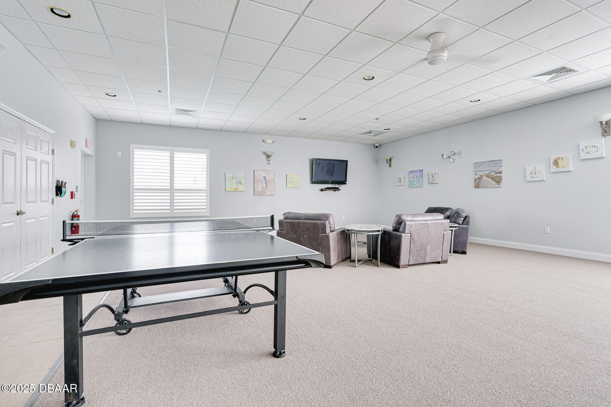 4650 Links Village Drive, Unit C303 Ponce Inlet, FL 32127 - Photo 57 of 67 a room with furniture pool table and windows